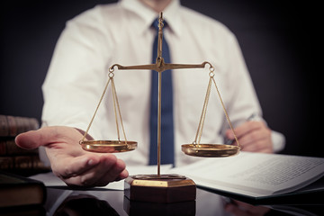 Weight scale of justice. Lawyer working in office