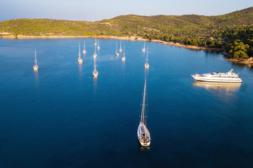 Aerial view of yachts and sailing boats at the marina of Spetses island, Aegean sea, Greece.