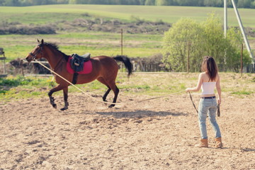 girl trains horse