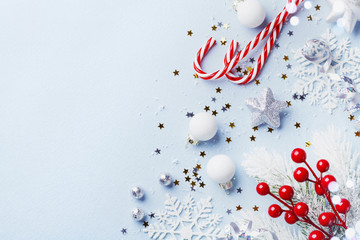 Christmas card or banner. Christmas silver decorations on blue background.