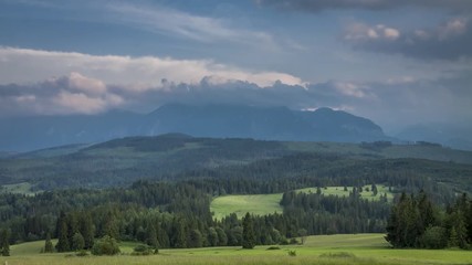 Clouds moving over Tatra Mountains at sunset, Poland, timelapse, 4K