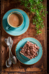 Top view of sweet and tasty cheesecake served with coffee