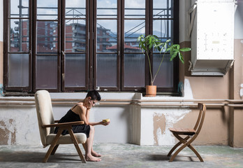 Woman and yellow cup