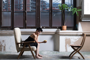 Woman and yellow cup