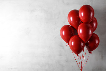  Balloons on concreat wall background