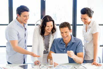 Group of happy young business people in a meeting