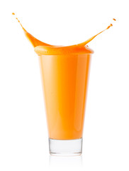 Splash in glass of carrot or orange smoothie or yogurt