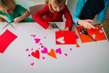 kids making hearts from paper, prepare for valentine day