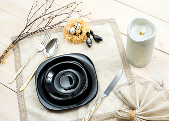 Spring Easter Table setting on a wooden table. Top view