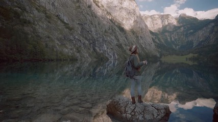 Young attractive girl by the lake