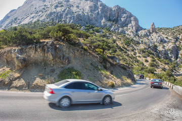 Cars Moves along a winding road in the mountains