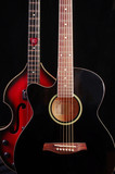 Acoustic guitar and bass guitar on the dark
