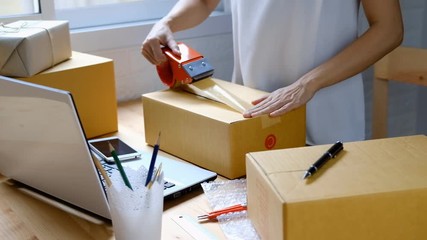 Young startup small business entrepreneur woman working with smart phone at home, Online business and delivery concept