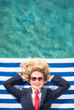 Successful young businesswoman on a beach