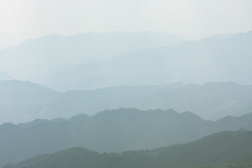 Landscape layers mountains in haze