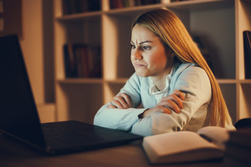 Student learning at home. Watching online course.