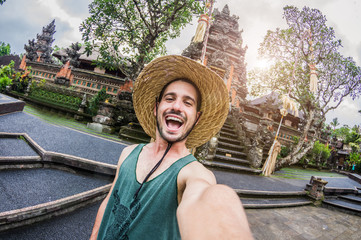 Excited man taking a selfie on a trip in Bali