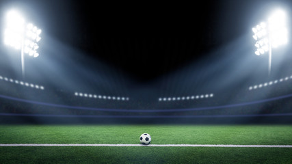 Tradition soccer ball illumintaed by stadium lights