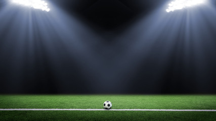 Tradition soccer ball illumintaed by stadium lights