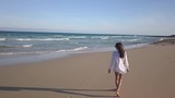 girl walking alone on the beach