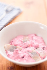 Herring Salad with Beet in bowl selective focus