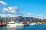 yachts in harbor against the backdrop of the mountains