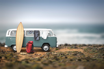 Tourist camp with bags, surfboard and car on the ocean