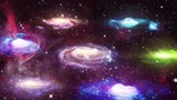 multiple spinning galaxies on starry background