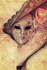 Close up of a pink woman venetian mask isolated on white background