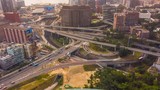 Hong Kong, China, China - January 28, 2019:timelapse aerial Orbit, circling, rotating shot showing hyperlapse of large highway interchange and railway line