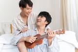 Young loving gay couple resting and spend time together.