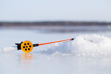 New fishing rod on blue ice
