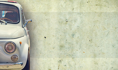 The headlight of the old beautiful car on the background of a concrete wall. Copy space. Concept banners repair, sale of cars.