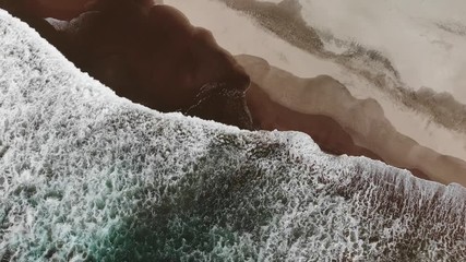 Wave on beach above top view from drone on sunny day