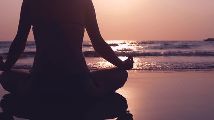 yoga, woman meditating on the beach, beautiful camera movement and backlight