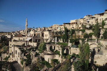 View of ancient Nevsehir cave town and a castle of Uchisar dug from a mountains in Cappadocia, Central Anatolia,Turkey