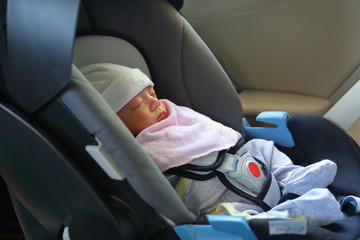 cute newborn baby sleeping in car seat safety belt lock protection drive road trip