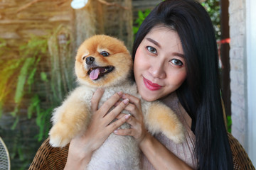 woman hugging love pomeranian dog cute pets