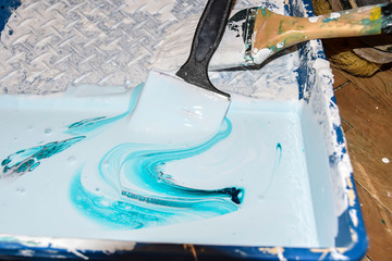brush flow of blue paint on a white background abstract bright colored background