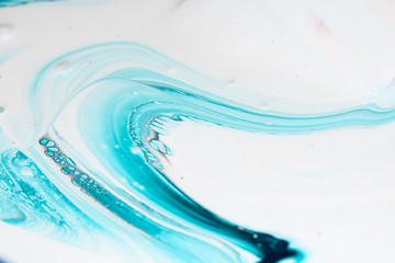 flow of blue paint on a white background abstract bright colored background