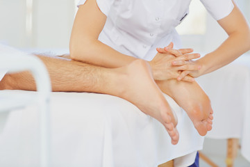 Foot massage in the spa salon.