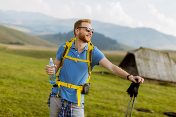 Handsome young red hair hiking man