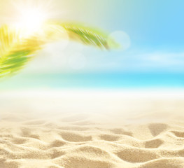 Sand with Palm and tropical beach bokeh background, Summer vacation and travel concept. Copy space