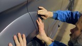 2015 Ford Edge gray sport. sports car cover tuning. on the technical service workers are getting ready to install sporting items on car