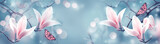 Mysterious spring background with pink magnolia flowers and flying butterfly. Magnificent floral banner.