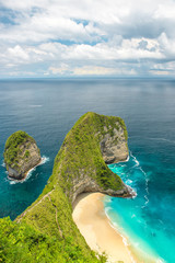 Sea rocks sand beach blue ocean Nusa Penida Island Bali
