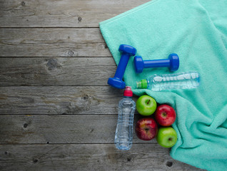 Colored Apples dumbbells sport water bottles and turquoise towel
