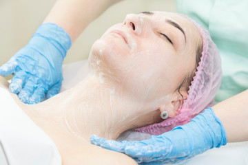 Process cosmetic mask of massage and facials in beauty salon 