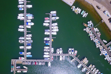 Yacht parking, A marina lot, Yacht and sailboat is moored at the quay, Aerial view by drone.