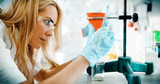 Female student of chemistry working in laboratory